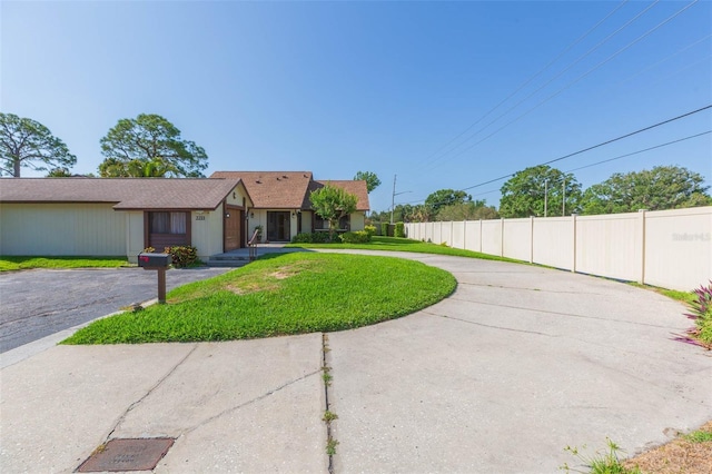 2211 Bay Berry Ln, Clearwater, FL 33763 - view of front of property featuring curved driveway and an attached garage