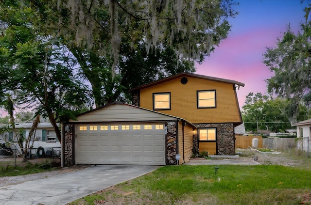 1010 Oakhill St, Seffner, FL 33584 - view of front facade featuring stone siding, driveway, and a garage