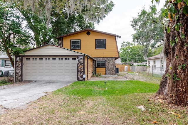 1010 Oakhill St, Seffner, FL 33584 - view of front of property featuring stone siding, a garage, and concrete driveway