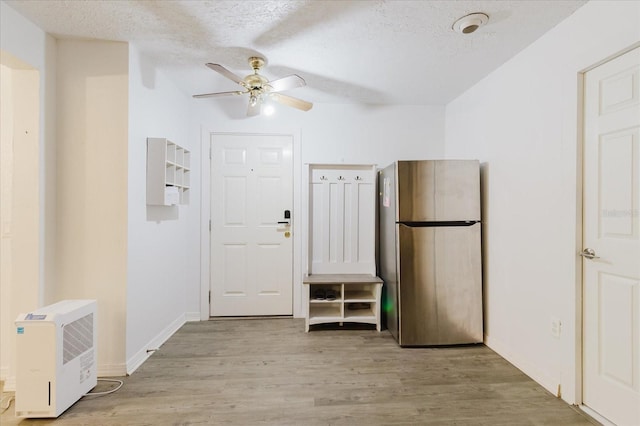 1010 Oakhill St, Seffner, FL 33584 - entrance foyer featuring a ceiling fan, wood finished floors, a textured ceiling, and baseboards