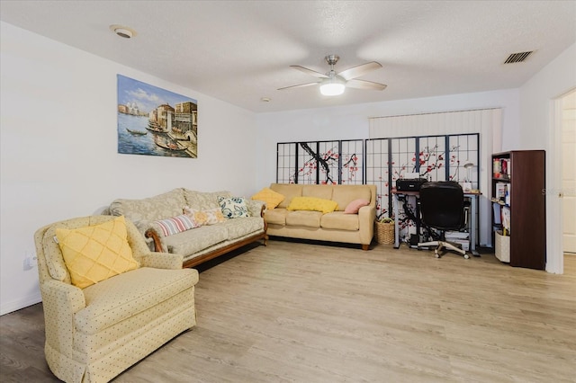 1010 Oakhill St, Seffner, FL 33584 - living area with wood finished floors, a ceiling fan, and a desk