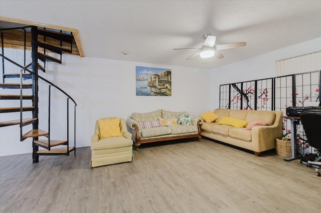 1010 Oakhill St, Seffner, FL 33584 - living room featuring wood finished floors, stairway, and ceiling fan