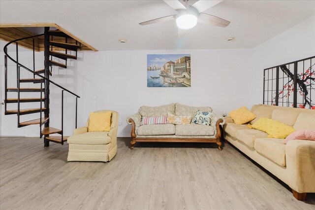 1010 Oakhill St, Seffner, FL 33584 - living area featuring wood finished floors, ceiling fan, stairway, and baseboards