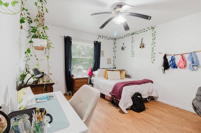 1010 Oakhill St, Seffner, FL 33584 - bedroom featuring wood finished floors, ceiling fan, and baseboards