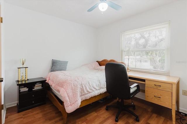 1010 Oakhill St, Seffner, FL 33584 - bedroom featuring dark wood-style flooring, ceiling fan, and baseboards