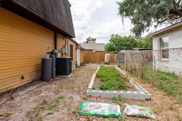 1010 Oakhill St, Seffner, FL 33584 - view of yard with fence and central AC