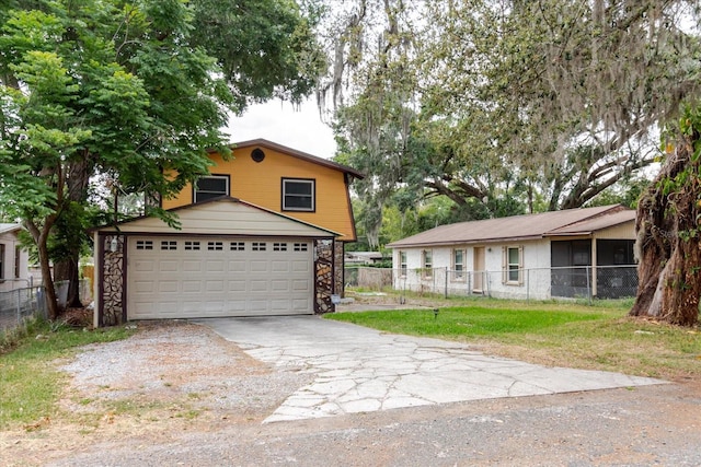 1010 Oakhill St, Seffner, FL 33584 - view of front of house featuring asphalt driveway, a garage, and stone siding