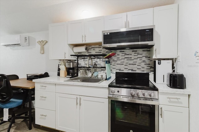 1010 Oakhill St, Seffner, FL 33584 - kitchen with appliances with stainless steel finishes, a sink, a wall mounted AC, light countertops, and tasteful backsplash