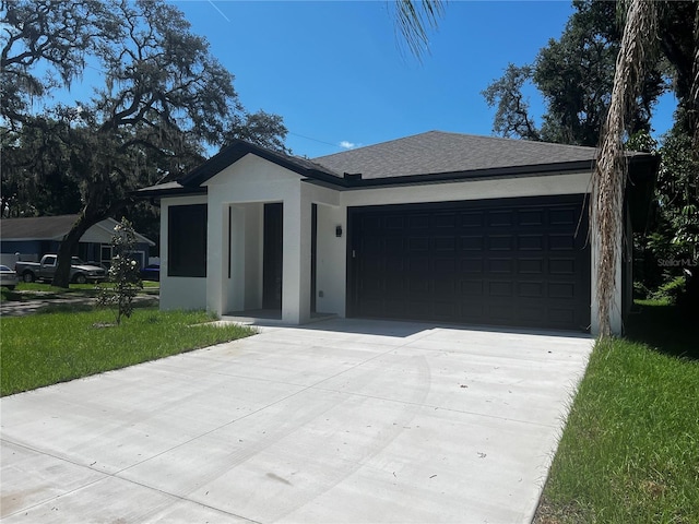 4241 E Palifox St, Tampa, FL 33610 - ranch-style house with driveway, a garage, stucco siding, a front lawn, and a shingled roof