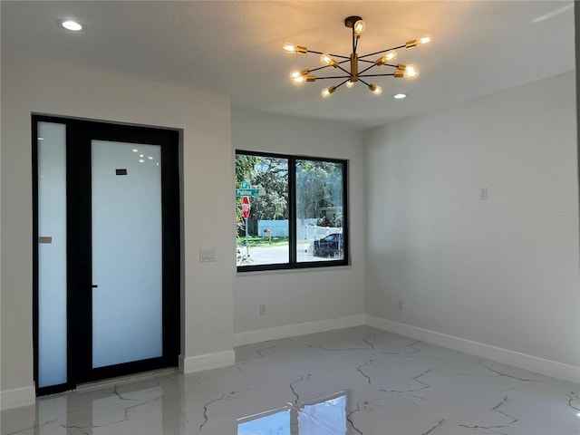 4241 E Palifox St, Tampa, FL 33610 - spare room featuring light marble finish floors, a chandelier, and recessed lighting