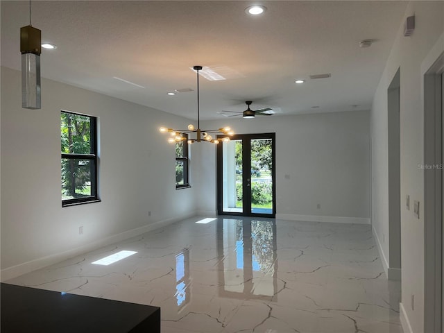 4241 E Palifox St, Tampa, FL 33610 - empty room featuring healthy amount of natural light, light marble finish flooring, recessed lighting, a chandelier, and ceiling fan