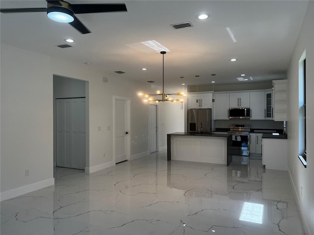4241 E Palifox St, Tampa, FL 33610 - kitchen featuring appliances with stainless steel finishes, dark countertops, recessed lighting, a ceiling fan, and white cabinets