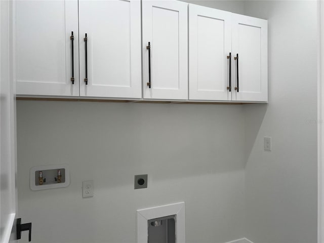 4241 E Palifox St, Tampa, FL 33610 - laundry area featuring cabinet space, hookup for a washing machine, and electric dryer hookup