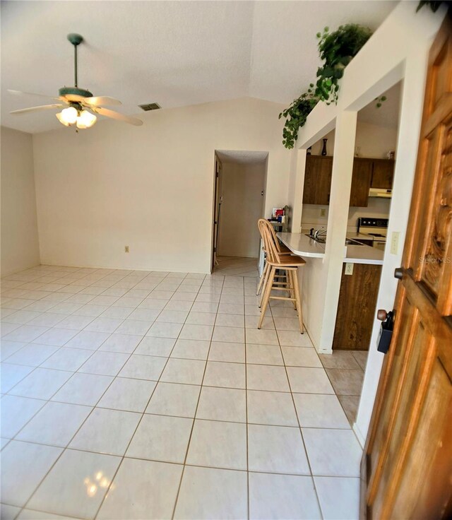 1262 Jeffords St, Clearwater, FL 33756 - unfurnished room with light tile patterned flooring, ceiling fan, and lofted ceiling