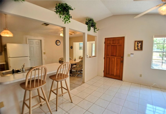 1262 Jeffords St, Clearwater, FL 33756 - foyer entrance with a ceiling fan, vaulted ceiling, and light tile patterned floors