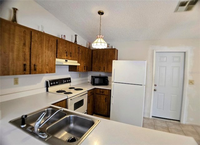 1262 Jeffords St, Clearwater, FL 33756 - kitchen with white appliances, under cabinet range hood, a sink, a textured ceiling, and light tile patterned floors