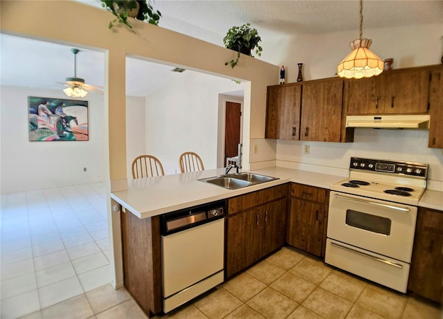 1262 Jeffords St, Clearwater, FL 33756 - kitchen featuring white appliances, under cabinet range hood, a sink, light tile patterned floors, and a textured ceiling