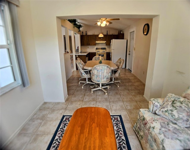 1262 Jeffords St, Clearwater, FL 33756 - dining space with ceiling fan, baseboards, lofted ceiling, and light tile patterned flooring