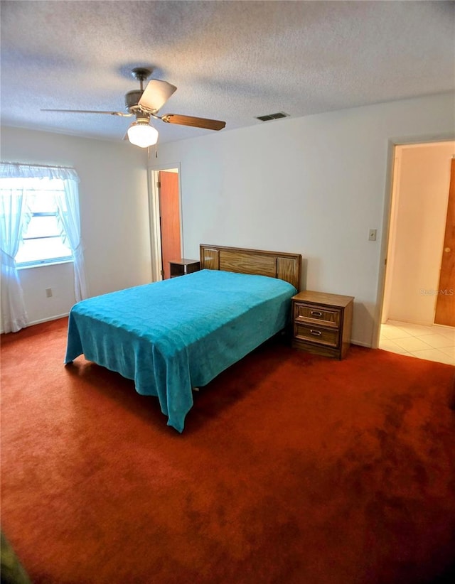 1262 Jeffords St, Clearwater, FL 33756 - carpeted bedroom featuring a textured ceiling and ceiling fan