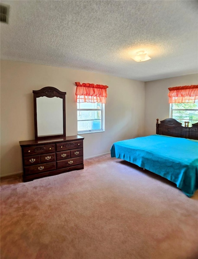 1262 Jeffords St, Clearwater, FL 33756 - carpeted bedroom featuring a textured ceiling and baseboards