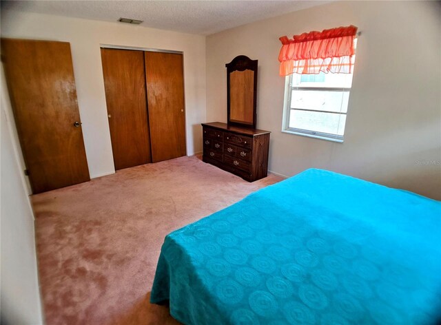1262 Jeffords St, Clearwater, FL 33756 - carpeted bedroom with a closet and a textured ceiling