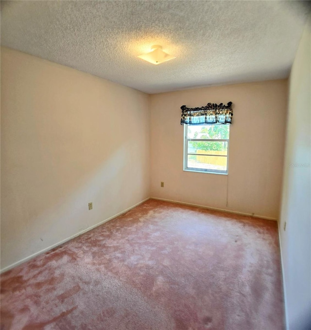 1262 Jeffords St, Clearwater, FL 33756 - empty room featuring carpet floors, a textured ceiling, and baseboards