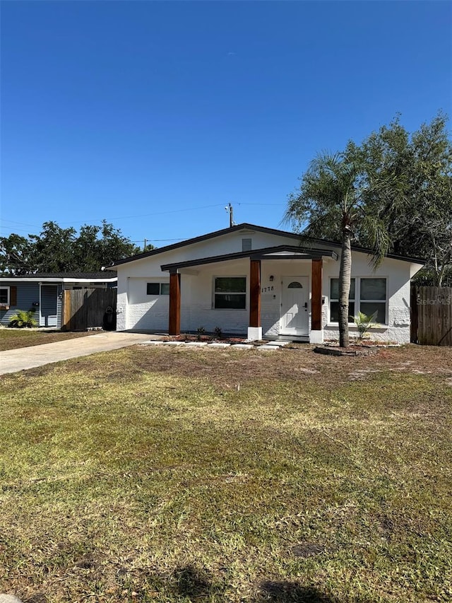 1778 New Hampshire Ave NE, Saint Petersburg, FL 33703 - view of front of home featuring concrete driveway and stucco siding