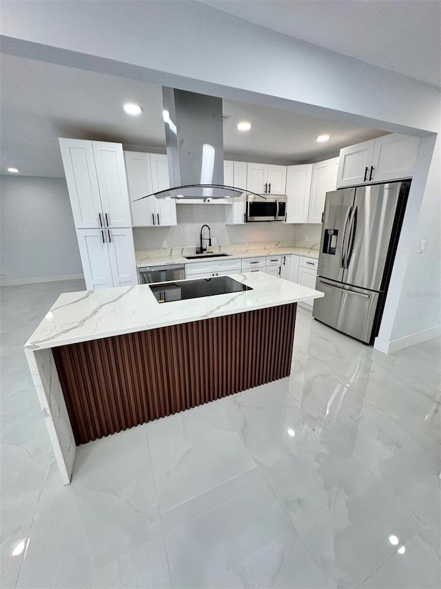 1778 New Hampshire Ave NE, Saint Petersburg, FL 33703 - kitchen featuring stainless steel appliances, island exhaust hood, baseboards, a sink, and white cabinetry