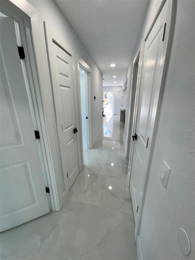 1778 New Hampshire Ave NE, Saint Petersburg, FL 33703 - corridor featuring light marble finish flooring