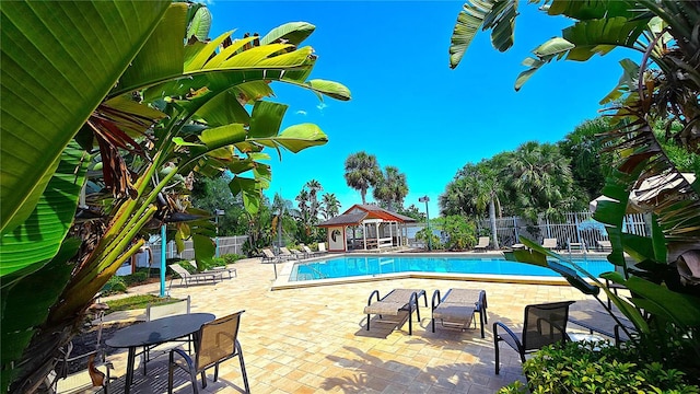 3907 Orchard Hill Cir, Palm Harbor, FL 34684 - community pool with fence and a patio area