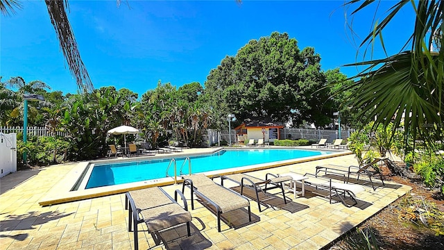 3907 Orchard Hill Cir, Palm Harbor, FL 34684 - community pool featuring fence and a patio