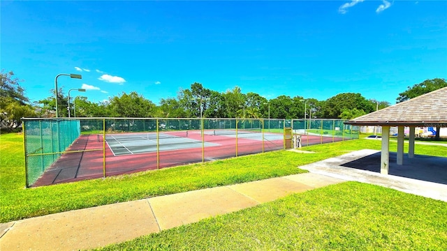 3907 Orchard Hill Cir, Palm Harbor, FL 34684 - view of tennis court featuring view of scattered trees