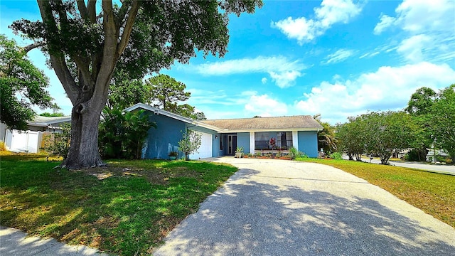3907 Orchard Hill Cir, Palm Harbor, FL 34684 - single story home with concrete driveway, a front lawn, a garage, and stucco siding