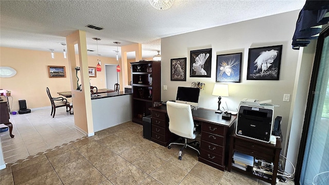 3907 Orchard Hill Cir, Palm Harbor, FL 34684 - office area featuring a textured ceiling, light tile patterned flooring, and baseboards