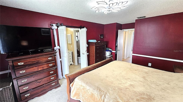 3907 Orchard Hill Cir, Palm Harbor, FL 34684 - bedroom featuring a textured ceiling and carpet floors