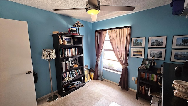 3907 Orchard Hill Cir, Palm Harbor, FL 34684 - office featuring a textured ceiling, carpet flooring, ceiling fan, and baseboards