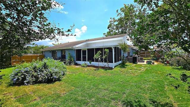3907 Orchard Hill Cir, Palm Harbor, FL 34684 - back of house featuring a sunroom