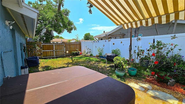 3907 Orchard Hill Cir, Palm Harbor, FL 34684 - fenced backyard with a patio