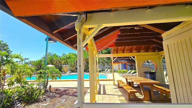 3907 Orchard Hill Cir, Palm Harbor, FL 34684 - community pool featuring a patio and fence