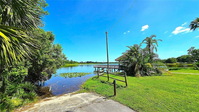 3907 Orchard Hill Cir, Palm Harbor, FL 34684 - surrounding community featuring a lawn, a water view, and a boat ramp