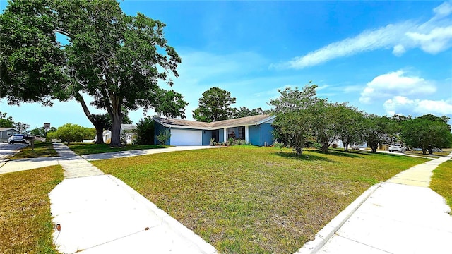 3907 Orchard Hill Cir, Palm Harbor, FL 34684 - view of front of home featuring a front lawn, driveway, and a garage