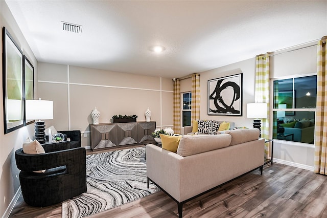 living area featuring wood finished floors and baseboards