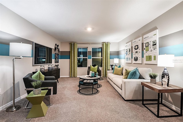 carpeted living area with baseboards