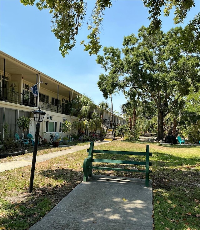 view of property's community with a yard