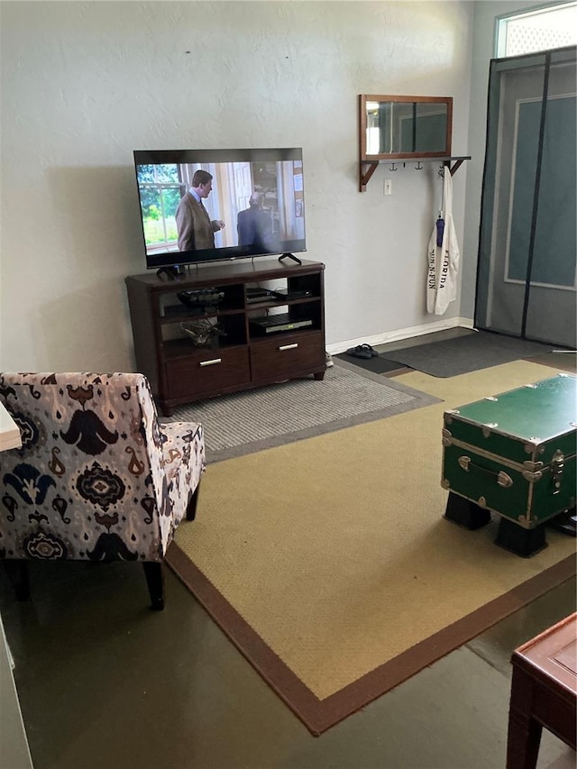 living room featuring baseboards