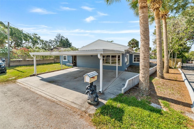 6726 Udell Ln, Hudson, FL 34667 - ranch-style home featuring driveway and a carport