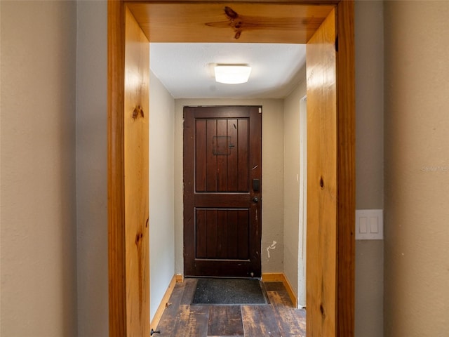 6726 Udell Ln, Hudson, FL 34667 - entryway with dark wood-style flooring and baseboards