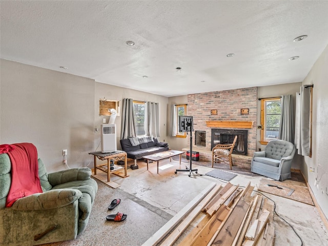 6726 Udell Ln, Hudson, FL 34667 - living room with a brick fireplace, a textured ceiling, and baseboards