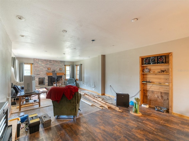 6726 Udell Ln, Hudson, FL 34667 - living room with wood finished floors, a brick fireplace, and baseboards