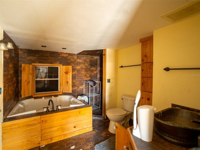 6726 Udell Ln, Hudson, FL 34667 - bathroom with toilet and a garden tub